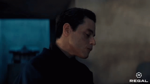 A Close Up Of A Man 'S Face With The Regal Logo In The Corner GIF