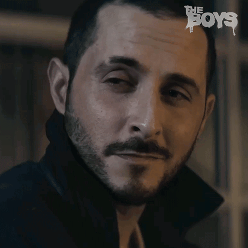 A Close Up Of A Man 'S Face With The Word Boys On The Bottom Right GIF