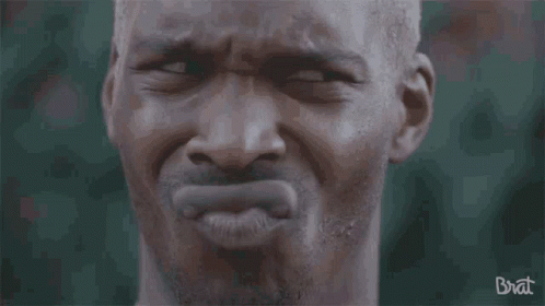 A Close Up Of A Man 'S Face With The Word Brat Written On The Bottom GIF