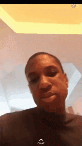 A Close Up Of A Man 'S Face With The Word Chat On The Bottom Right Corner GIF