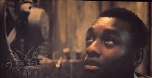 A Close Up Of A Man 'S Face With The Word Geekset On The Bottom Right GIF