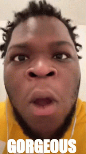 A Close Up Of A Man 'S Face With The Word Gorgeous On The Bottom Right GIF