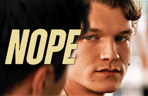 A Close Up Of A Man 'S Face With The Word Nope Behind It GIF