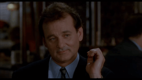 A Close Up Of A Man 'S Face With The Word Oui In The Corner GIF