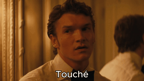 A Close Up Of A Man 'S Face With The Word Touche Below It GIF