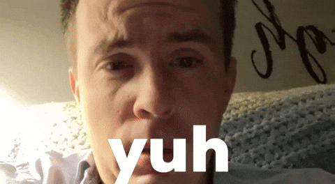 A Close Up Of A Man 'S Face With The Word Yuh Written Below It GIF