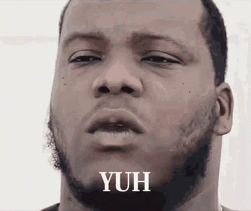 A Close Up Of A Man 'S Face With The Word Yuh Written On It GIF