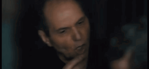 A Close Up Of A Man 'S Face With The Words Are You Stupid Below Him GIF