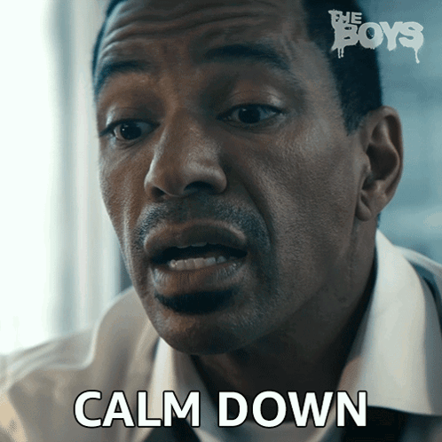 A Close Up Of A Man 'S Face With The Words Calm Down On The Bottom GIF