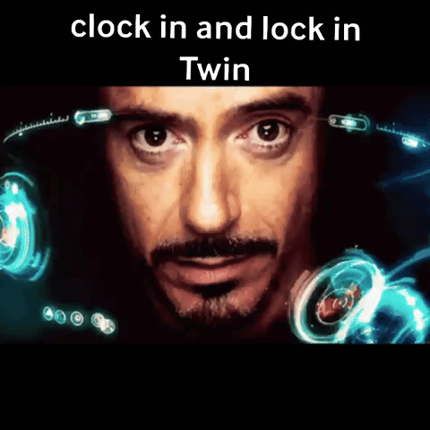 A Close Up Of A Man 'S Face With The Words " Clock In And Lock In Twin " Above Him GIF