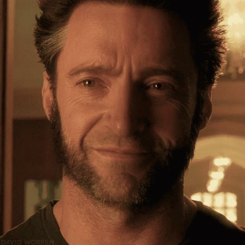 A Close Up Of A Man 'S Face With The Words David Worren On The Bottom Right GIF