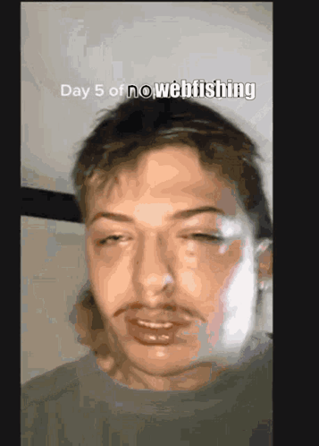 A Close Up Of A Man 'S Face With The Words " Day 5 Of No Webfishing " Above Him GIF