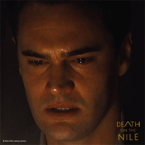a close up of a man 's face with the words death on the nile above him