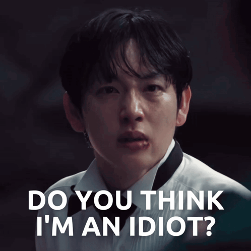 A Close Up Of A Man 'S Face With The Words " Do You Think I 'M An Idiot " Above Him GIF