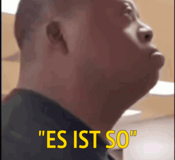 A Close Up Of A Man 'S Face With The Words " Es Ist So " On The Bottom GIF