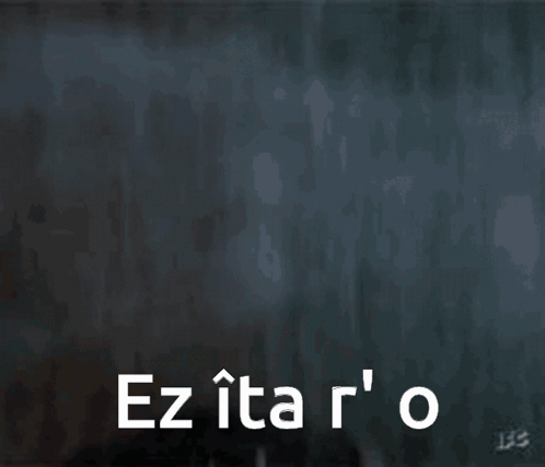 A Close Up Of A Man 'S Face With The Words Ez Ita R ' O GIF