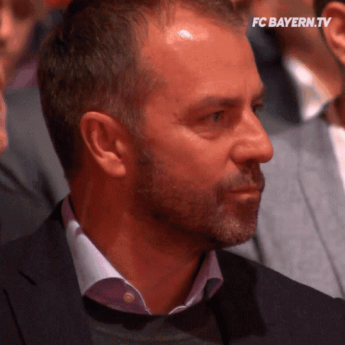 A Close Up Of A Man 'S Face With The Words Fc Bayern.tv Visible GIF
