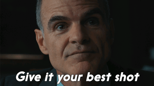 A Close Up Of A Man 'S Face With The Words Give It Your Best Shot Below Him GIF