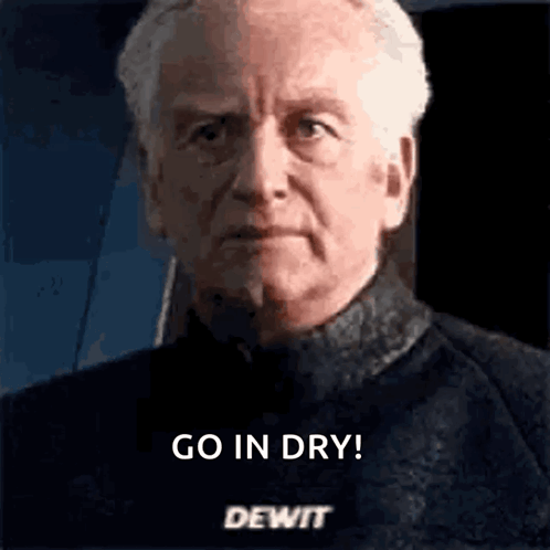 A Close Up Of A Man 'S Face With The Words `` Go In Dry Dewit '' Written On It . GIF