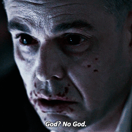 A Close Up Of A Man 'S Face With The Words God No God Written Below It GIF