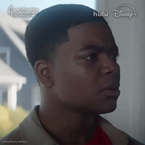 A Close Up Of A Man 'S Face With The Words Goosebumps On The Bottom Left GIF