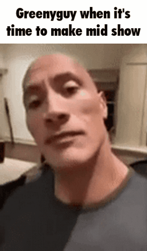 A Close Up Of A Man 'S Face With The Words Greenyguy When It 'S Time To Make Mid Show GIF