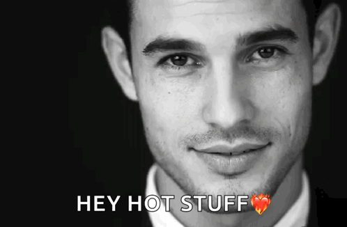 A Close Up Of A Man 'S Face With The Words Hey Hot Stuff Above It GIF