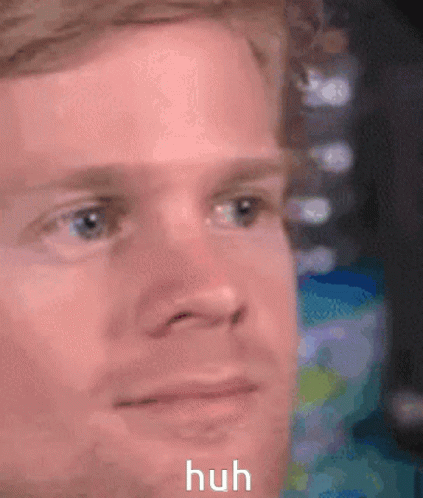 A Close Up Of A Man 'S Face With The Words Huh Written Below It . GIF