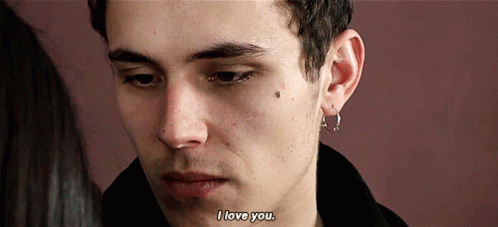 A Close Up Of A Man 'S Face With The Words " I Love You " On The Bottom GIF