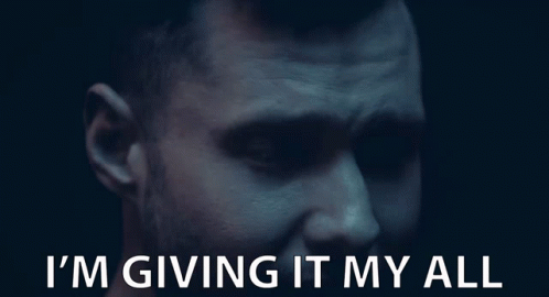 A Close Up Of A Man 'S Face With The Words I 'M Giving It My All Below Him GIF