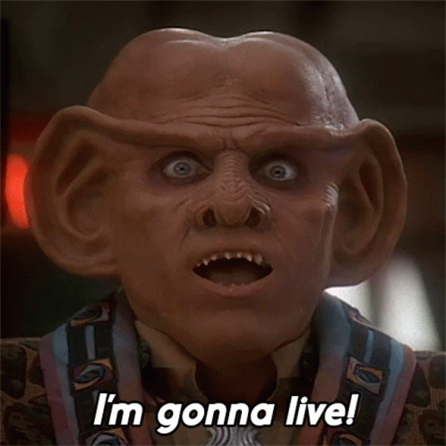 A Close Up Of A Man 'S Face With The Words I 'M Gonna Live GIF