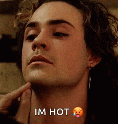 A Close Up Of A Man 'S Face With The Words `` I 'M Hot '' Written On The Bottom . GIF