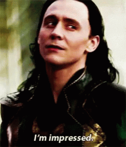A Close Up Of A Man 'S Face With The Words `` I 'M Impressed '' Written On The Bottom . GIF