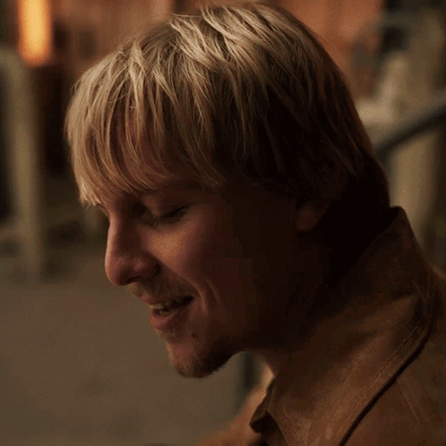 A Close Up Of A Man 'S Face With The Words " I 'M Trying " Above Him GIF