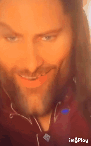 A Close Up Of A Man 'S Face With The Words Imgplay At The Bottom Right GIF