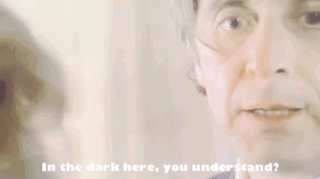 A Close Up Of A Man 'S Face With The Words In The Dark Here You Understand Below It GIF