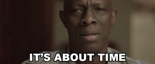 A Close Up Of A Man 'S Face With The Words `` It 'S About Time '' Written Above Him . GIF