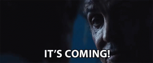 A Close Up Of A Man 'S Face With The Words It 'S Coming Written Below It GIF