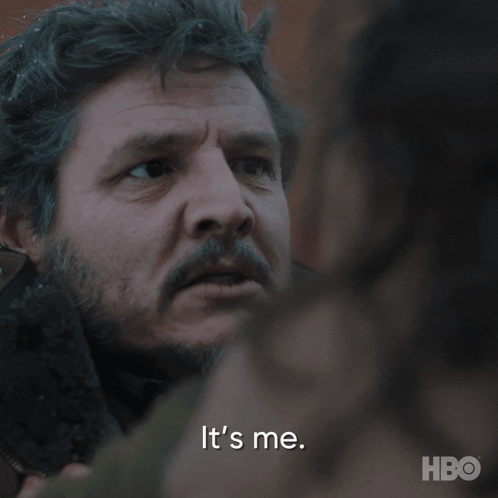 A Close Up Of A Man 'S Face With The Words It 'S Me Behind Him GIF