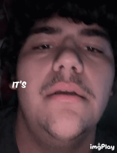A Close Up Of A Man 'S Face With The Words It 'S Written On His Cheek GIF