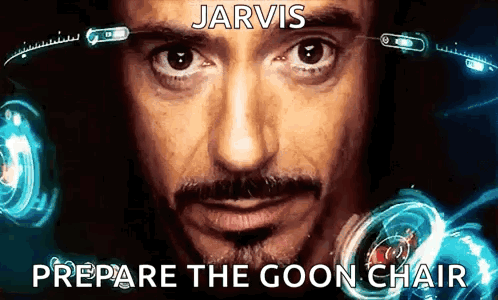 A Close Up Of A Man 'S Face With The Words Jarvis Prepare The Goon Chair Above Him GIF