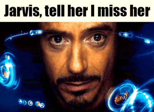 A Close Up Of A Man 'S Face With The Words Jarvis Tell Her I Miss Her Above Him GIF