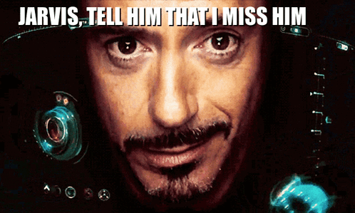 A Close Up Of A Man 'S Face With The Words Jarvis Tell Him That I Miss Him Above It GIF