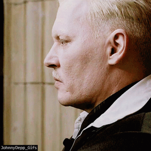 A Close Up Of A Man 'S Face With The Words Johnnydepp_gifs Below It GIF