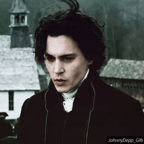 A Close Up Of A Man 'S Face With The Words Johnnydepp_gifs Below It GIF