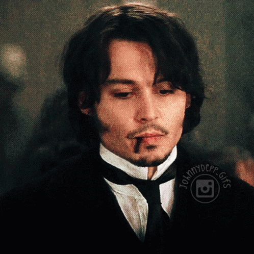 A Close Up Of A Man 'S Face With The Words Johnnydepp.gifs Visible GIF