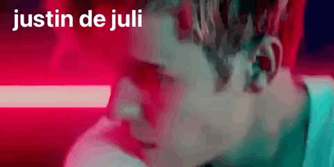 A Close Up Of A Man 'S Face With The Words Justin De Juli Written On The Bottom . GIF