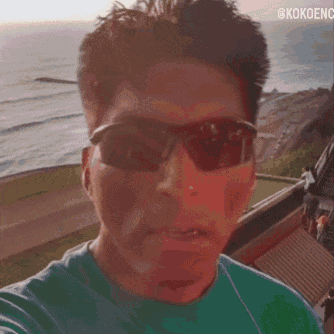A Close Up Of A Man 'S Face With The Words @Kokoenc On The Bottom GIF
