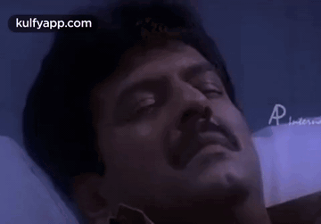 A Close Up Of A Man 'S Face With The Words Kulfyapp.com In The Upper Right Corner GIF