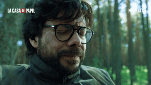 A Close Up Of A Man 'S Face With The Words La Casa De Papel In Red GIF